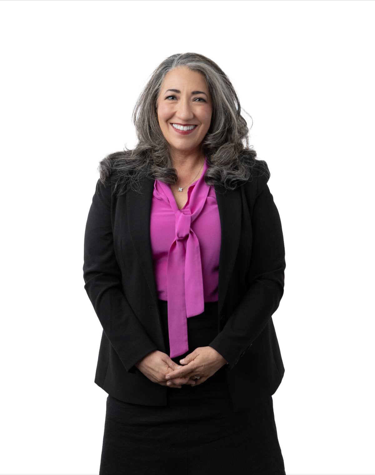 Dr. Andrea Matsumura wearing a black blazer and pink blouse on a white background
